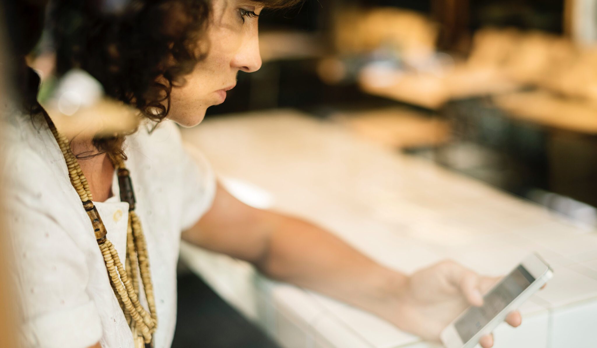 woman researching fertility insurance options on phone