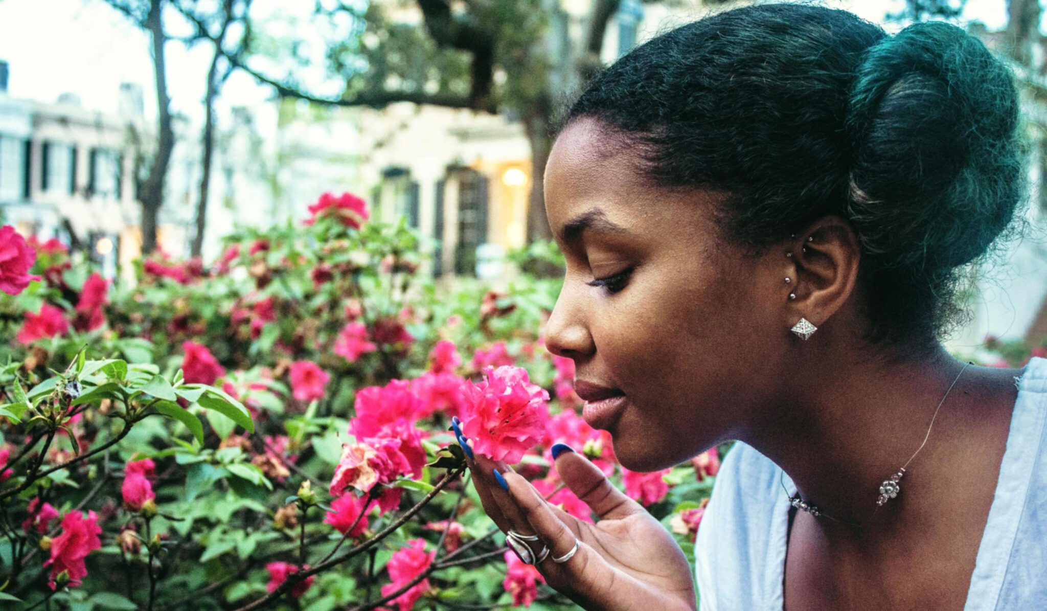 woman smelling roses representing living with PCOS