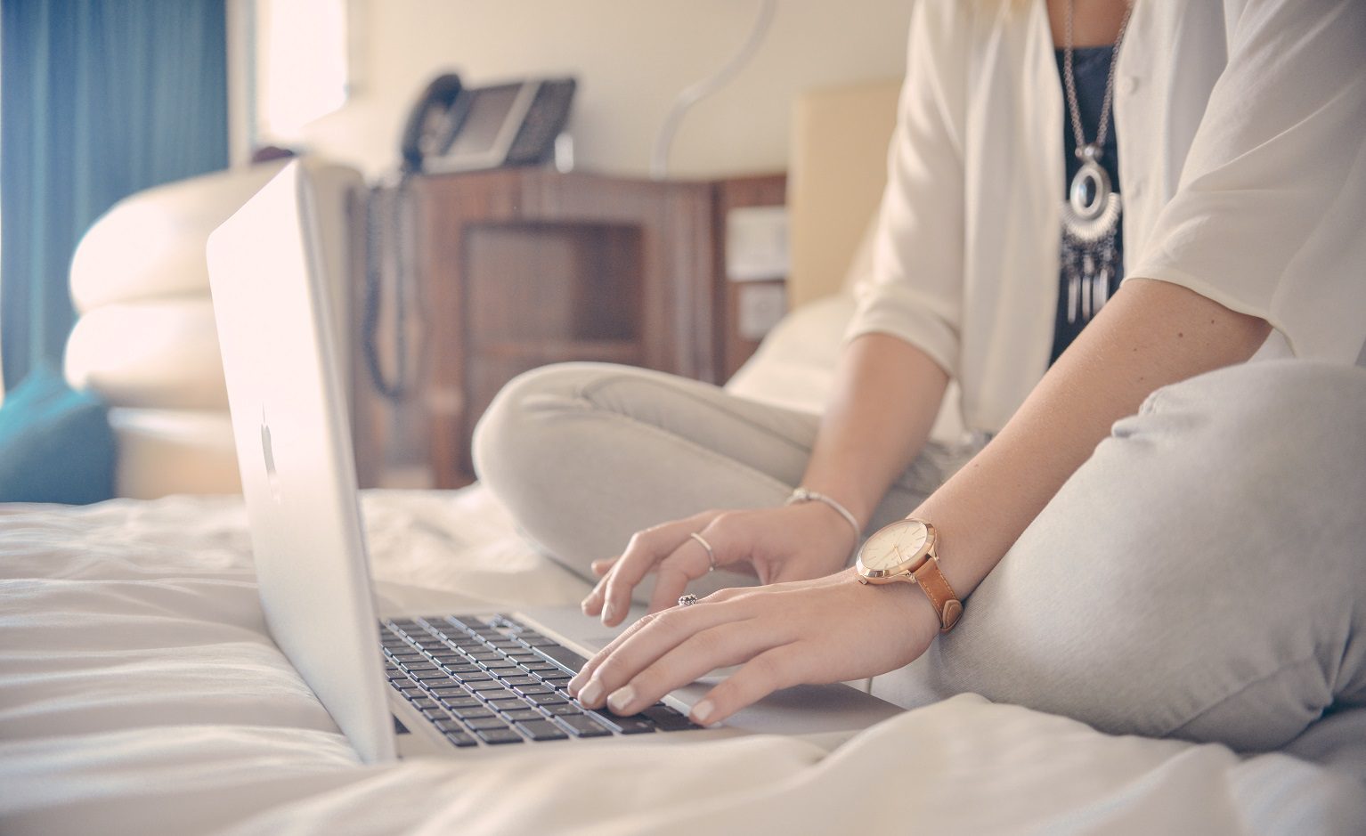 Telemedicine Consultant typing on laptop